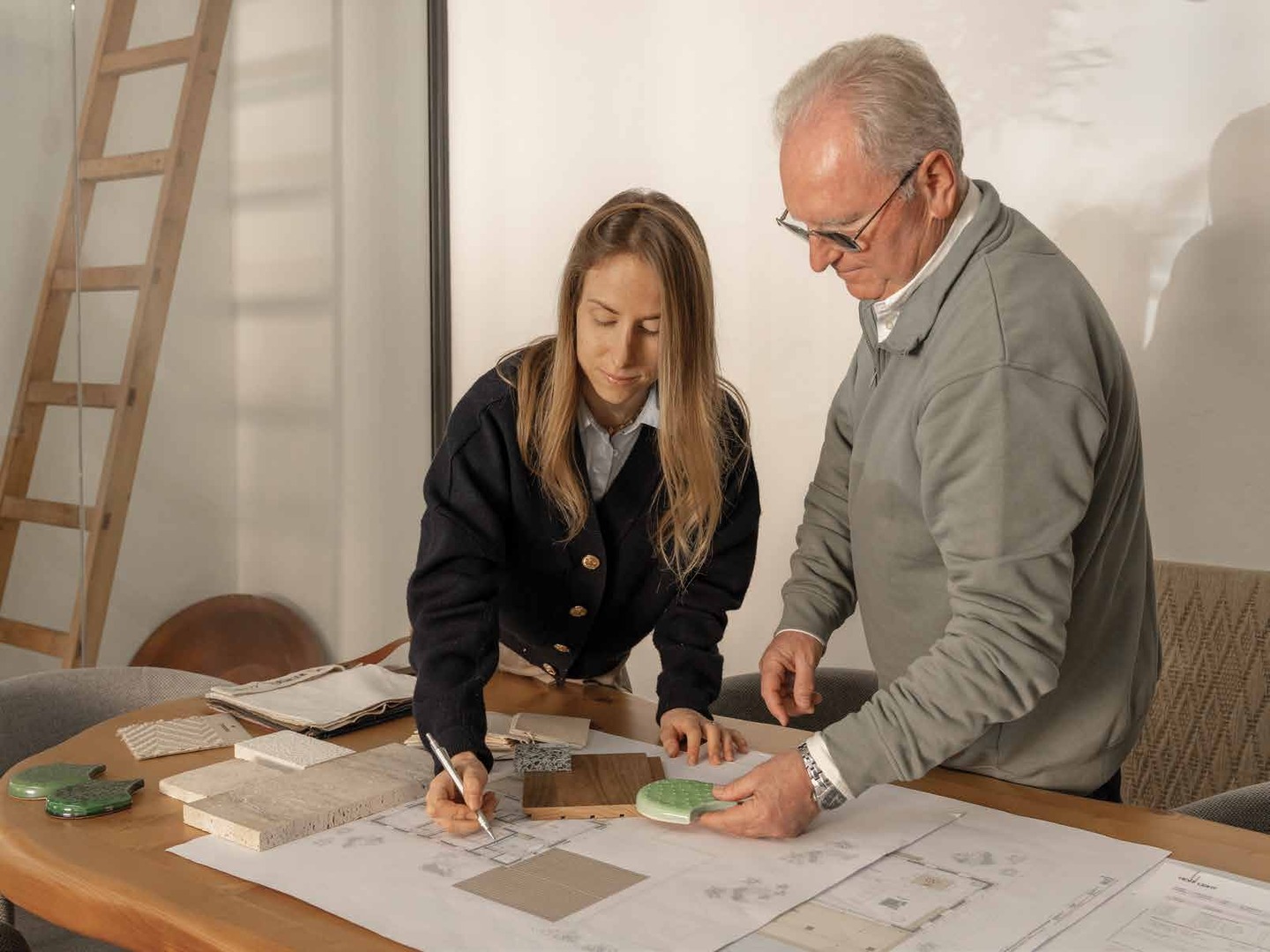 The team reviewing plans with a client